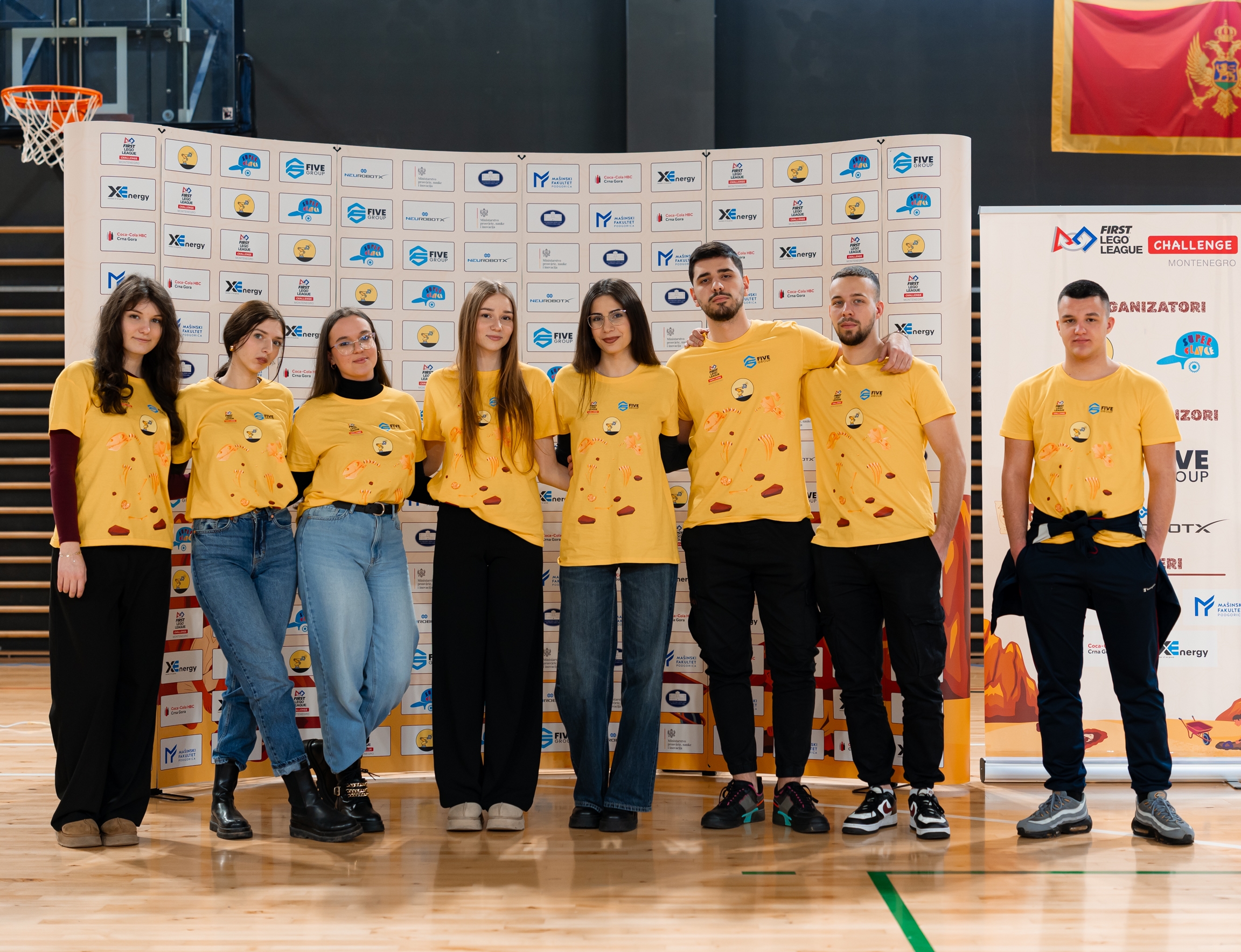 Volunteers and members of the organising team wearing event T-shirts at the national FIRST LEGO League Challenge competition in Montenegro