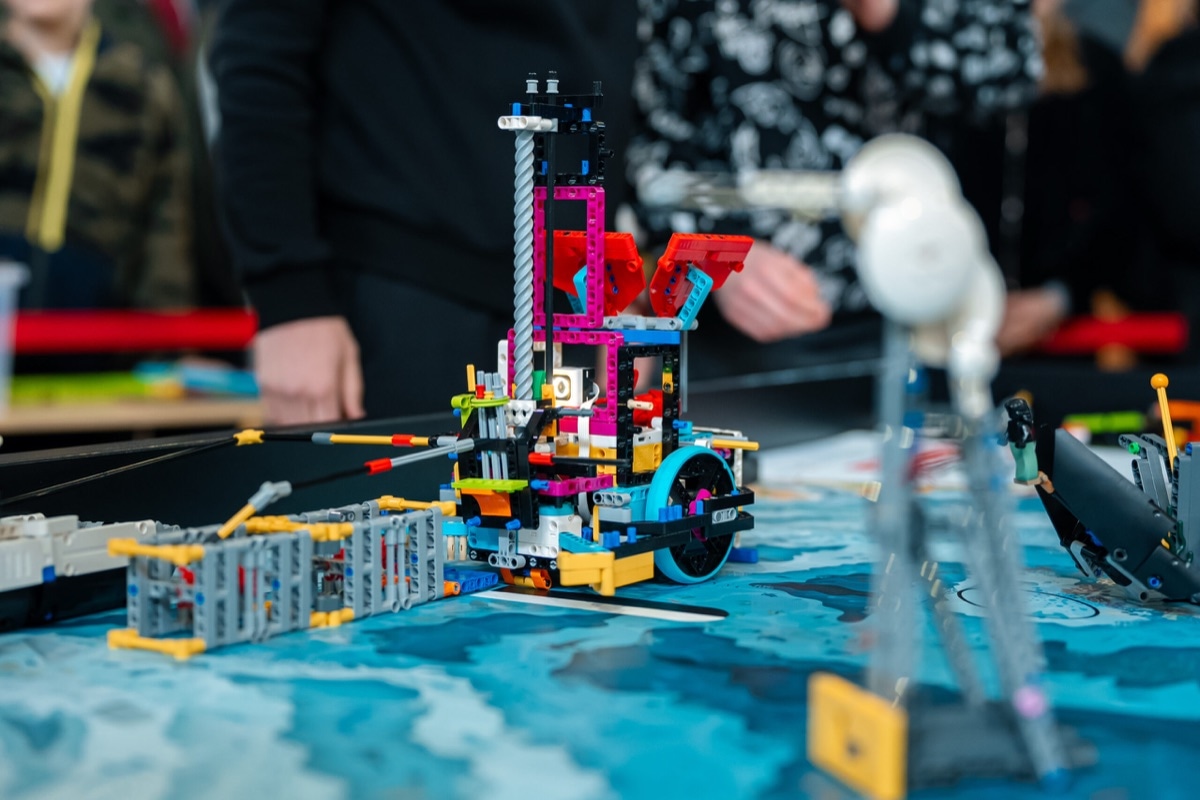 Close-up of a LEGO robot during a mission on the competition mat